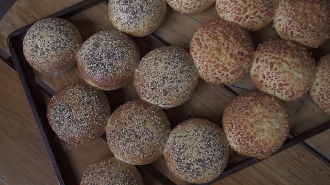 Orbit spin shot of homemade burger bread covered with cheese and sesame