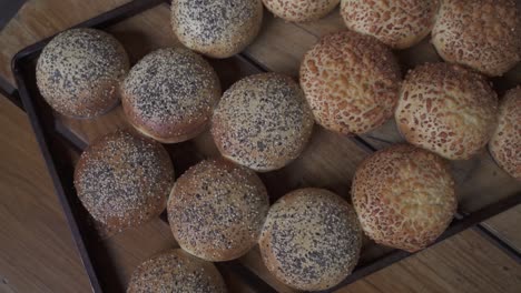 orbit spin shot of homemade burger bread covered with cheese and sesame