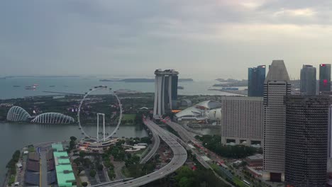 sunset time singapore city famous downtown bay flyer traffic coastline road aerial panorama 4k