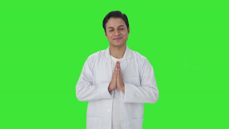 happy indian scientist doing namaste green screen