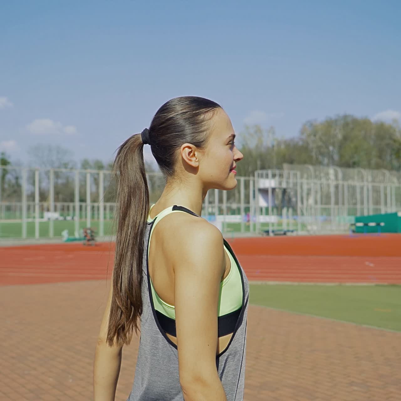 Female outdoor training. Sports girl is training at the stadium. Healthy lifestyle