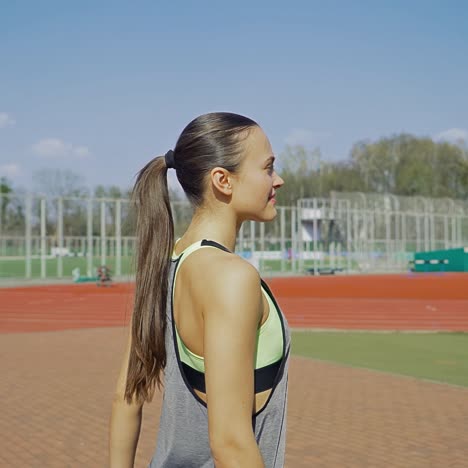 female outdoor training. sports girl is training at the stadium. healthy lifestyle