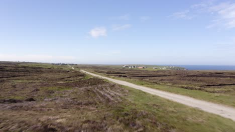 Dynamic-drone-shot-of-a-tractor-full-of-peat