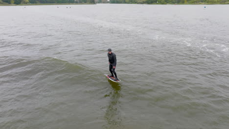 athlete on hydro foil surf in wave fly over lake in germany in 50fps