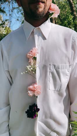 man in a white shirt with flowers