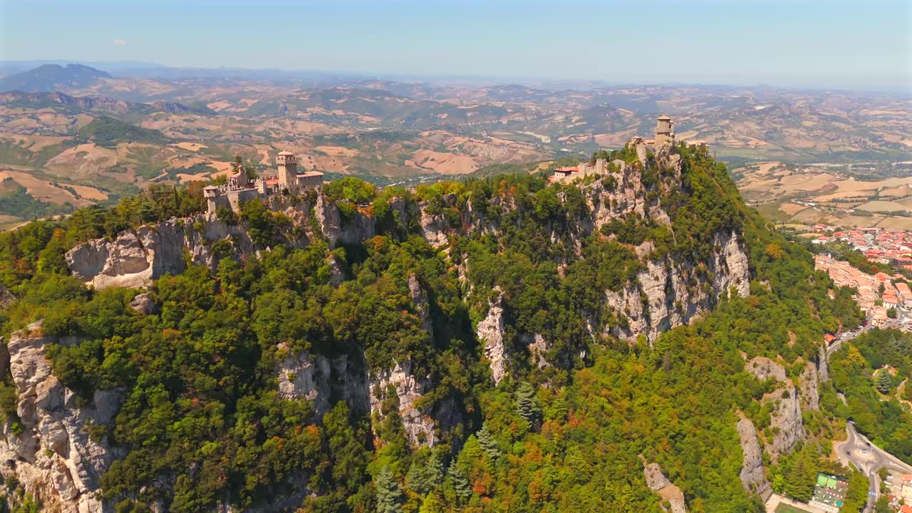 San Marino’s ancient castles dominate the skyline, filmed in breathtaking detail by a sweeping drone.