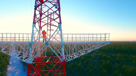 Electrical-engineer-working-on-electricity-pylon.-Electricity-industry-worker