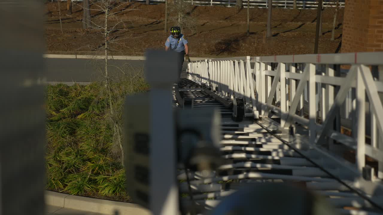 Firefighter tests a ladder on a fire truck during testing for emergency response