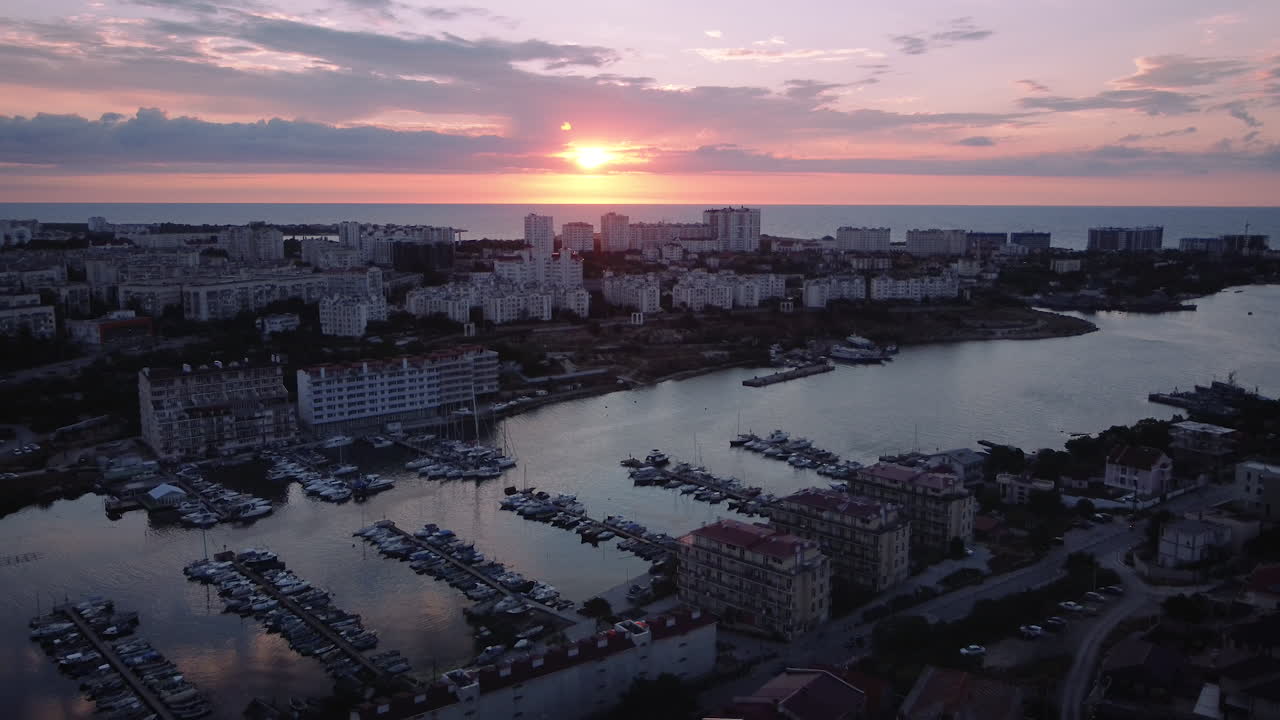 Sunset over Coastal City with Marina