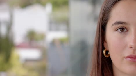close-up of woman with long hair wearing hoop earring, relaxing at home, copy space