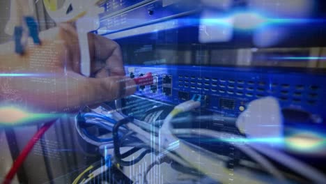 animation of data processing over hand of caucasian man connecting wires in server