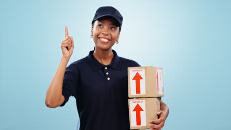 happy black woman, box and pointing up