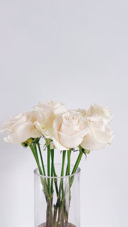 elegant bouquet of white roses in a clear vase