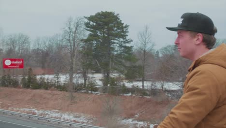 man watching cars on motorway