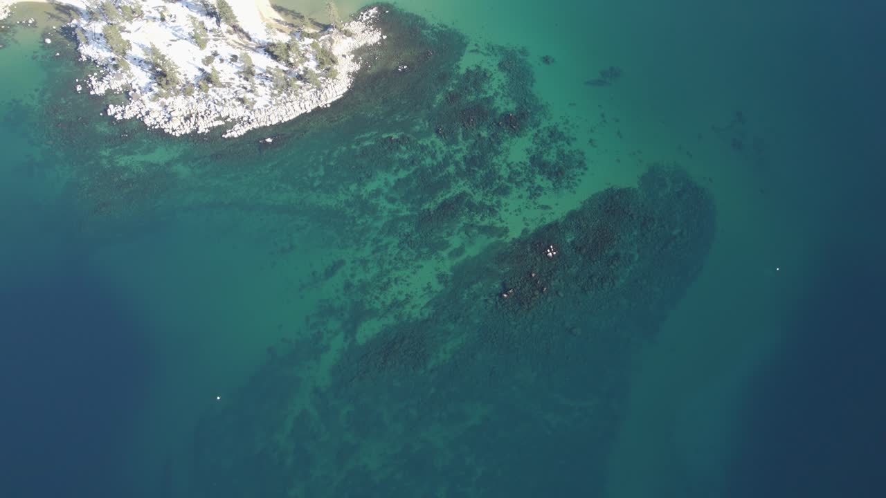 A high-flying, 4K drone shot over Lake Tahoe, California, during the winter season