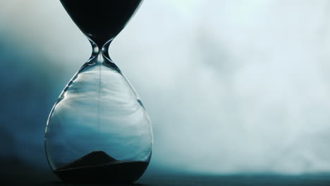 detail of old hourglass grains of sand