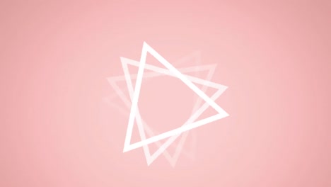 animation of red spots over white triangle spinning on pink background