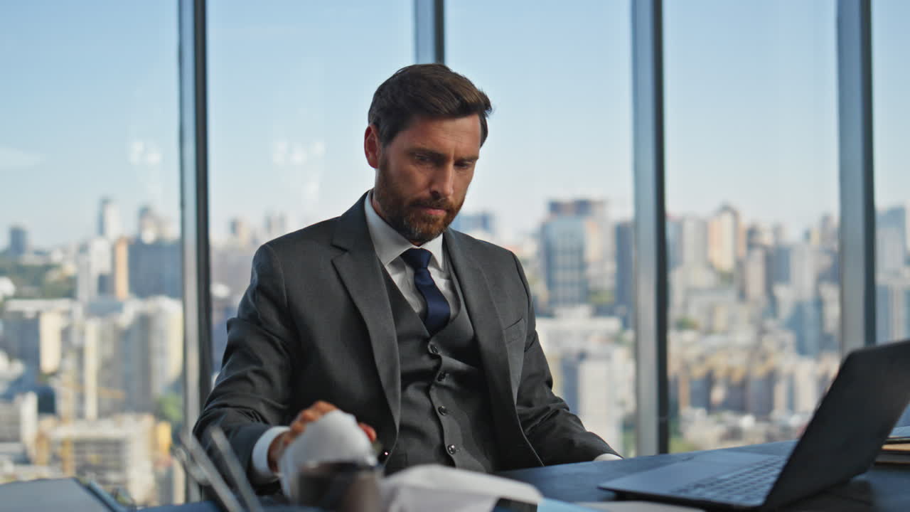 Frustrated executive thinking problem work in panoramic office. Sad stressed man