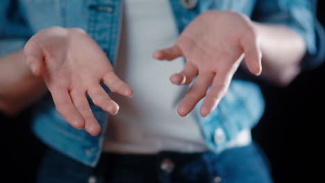 -Close-up-of-a-caucasian-woman's-hands-moving-as-a-gesture-of-talking-and-conversation