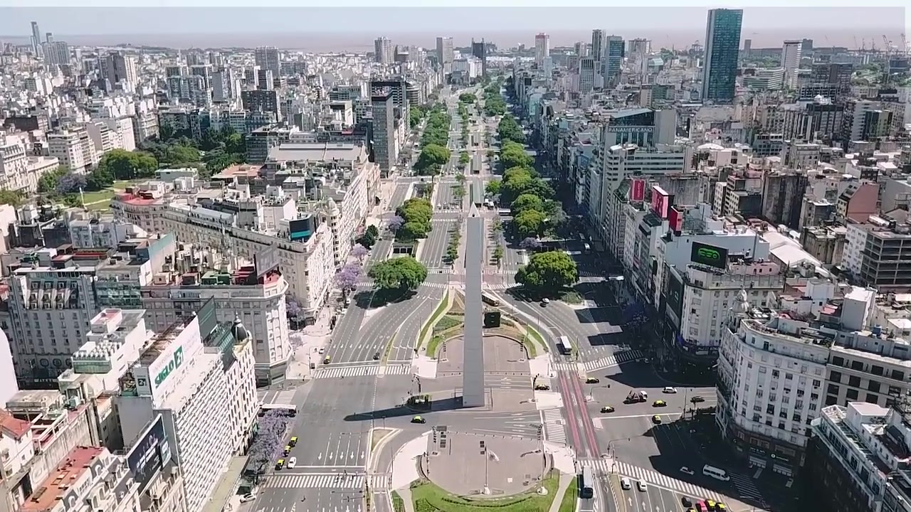 Aerial view moving around the obelisk of buenos aires, a national monument and icon of the city