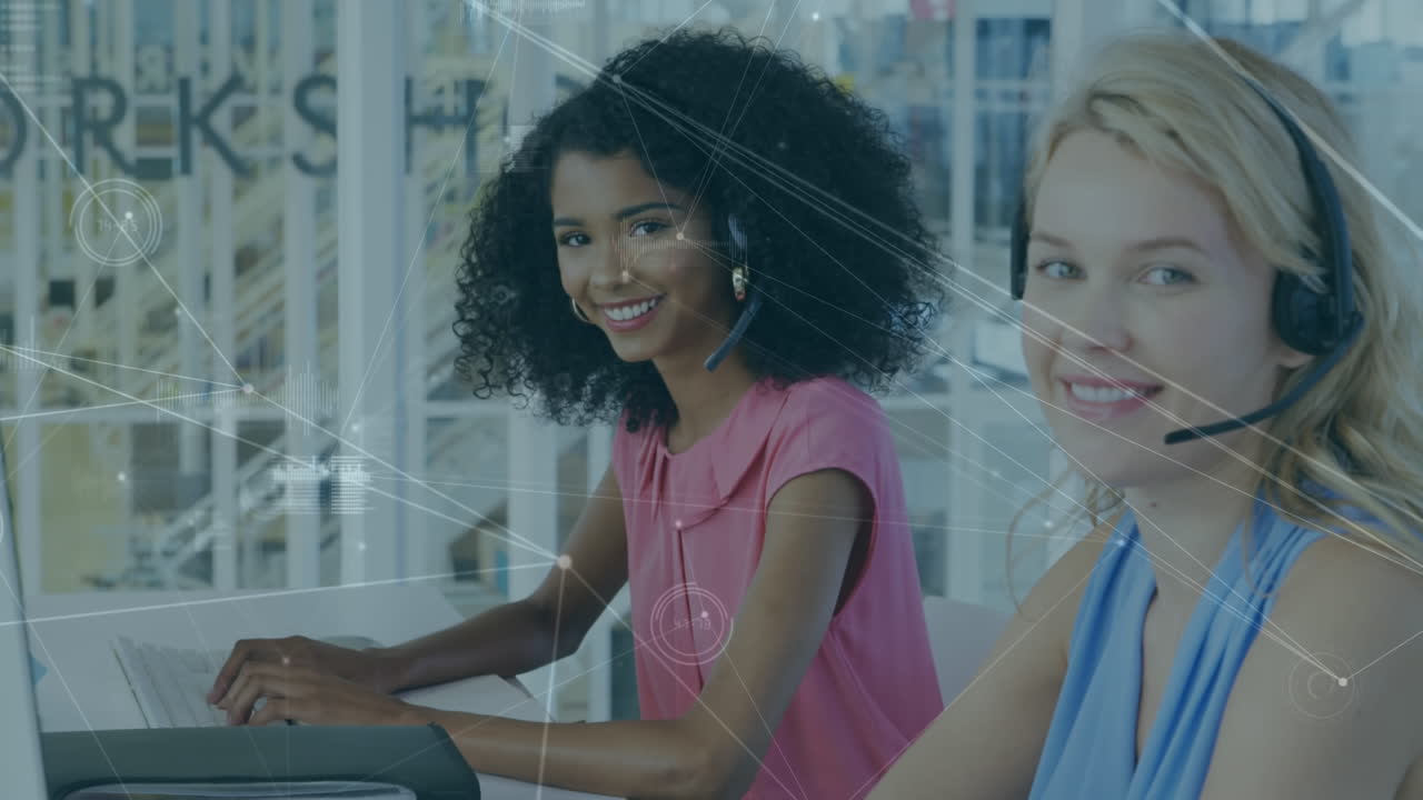 Network of connections against two diverse female office colleagues using phone headset at office