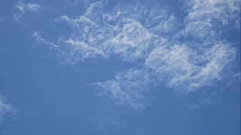 time lapse of white fluffy clouds in the blue sky background