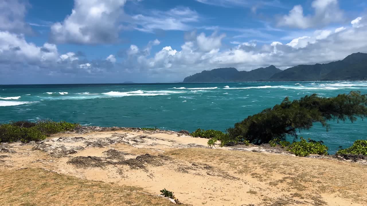 Calm waves on Oahu's west coast, blue skies and tranquility