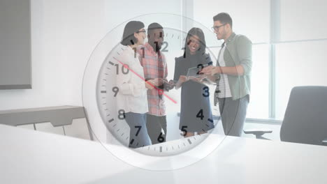 Animation-of-clock-moving-over-diverse-colleagues-talking-in-office