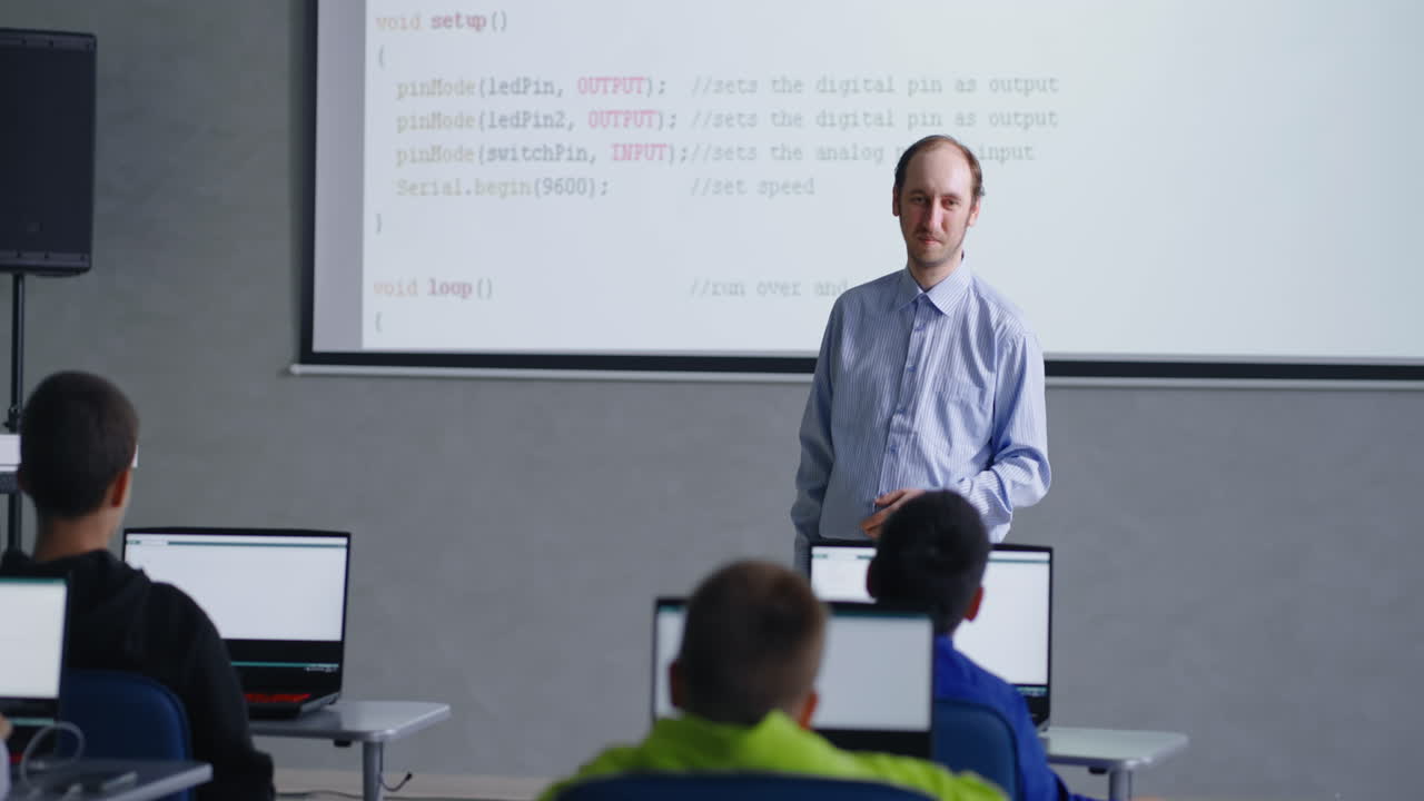 Teacher teaching programming in a classroom