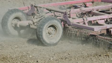 a tractor plowing dry agricultural field, preparing land for sowing. agricultural industry. processing the field in the farm.