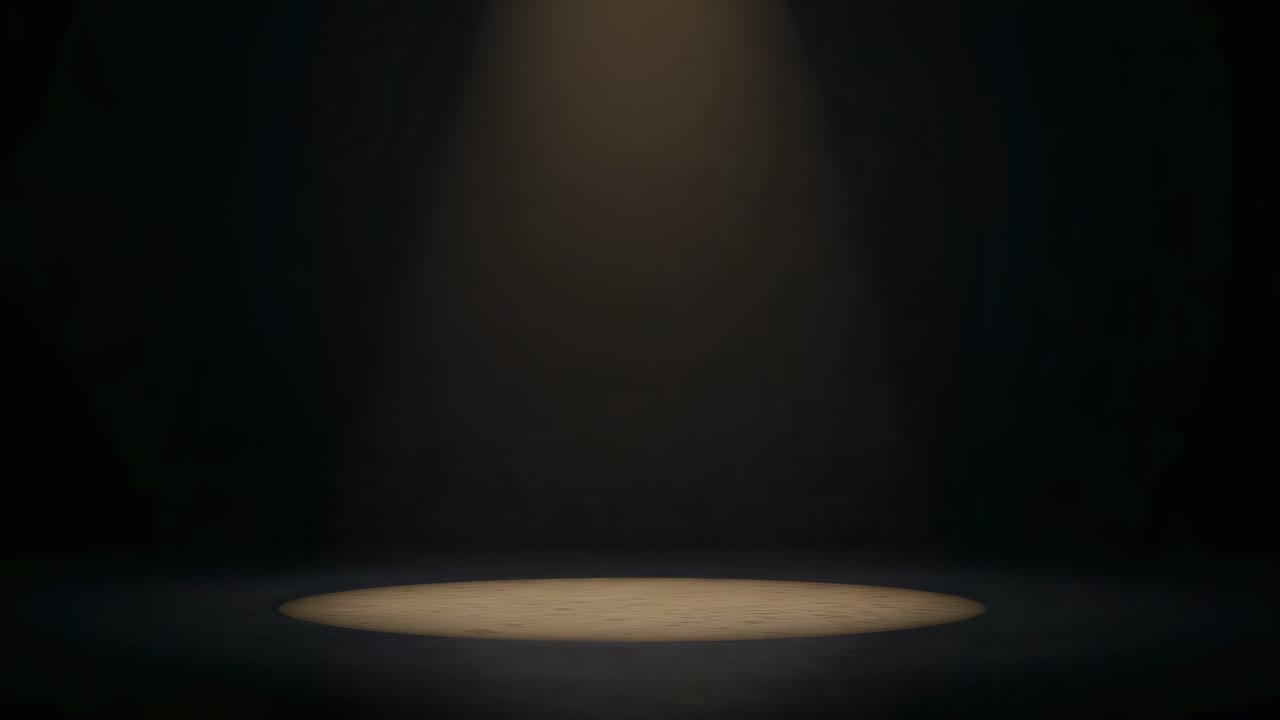 Bredere cirkulært oplyst gulvareal fra spotlight, der udvides og flyttes ned, hvilket blødgør scenen