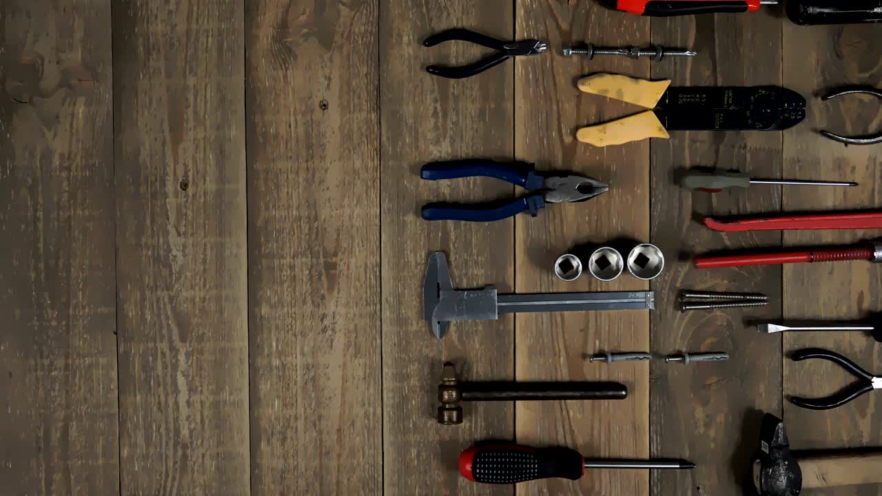 Animation of a hand tool for a home master on wooden background