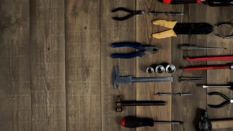 animation of a hand tool for a home master on wooden background