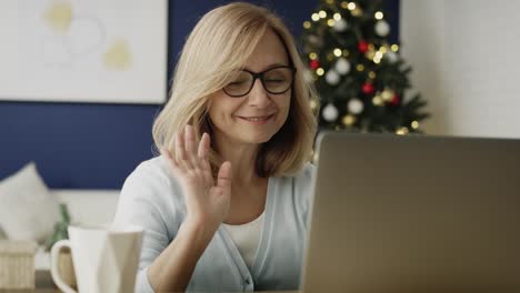 Video-of-grandmother-waving-to-laptop-on-remote-video-call