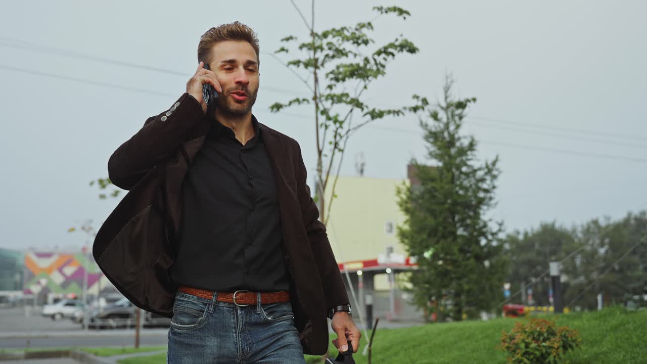 Businessman Walking and Talking on Phone