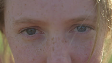 Closeup-of-a-teenage-girl's-eyes-and-face-outside-at-sunset