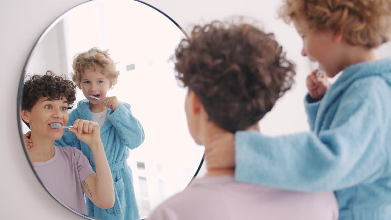 Mother and Child Brushing Teeth