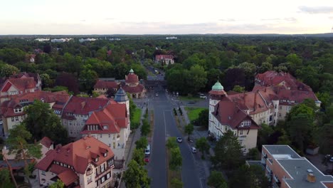 S-Bahn-station,-bridge-and-intersection-Marvelous-aerial-view-flight-fly-forward-drone-footage
of-mexikoplatz-berlin-zehlendorf-Summer-2022