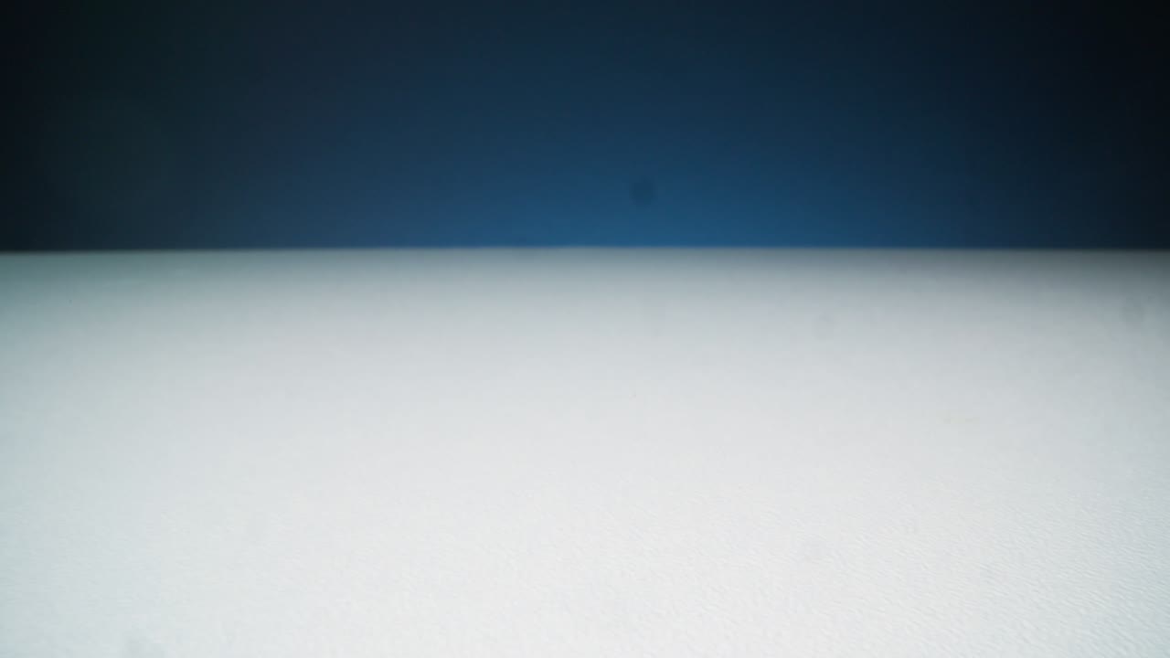 Spilling Gold Gel Balls On White Surface