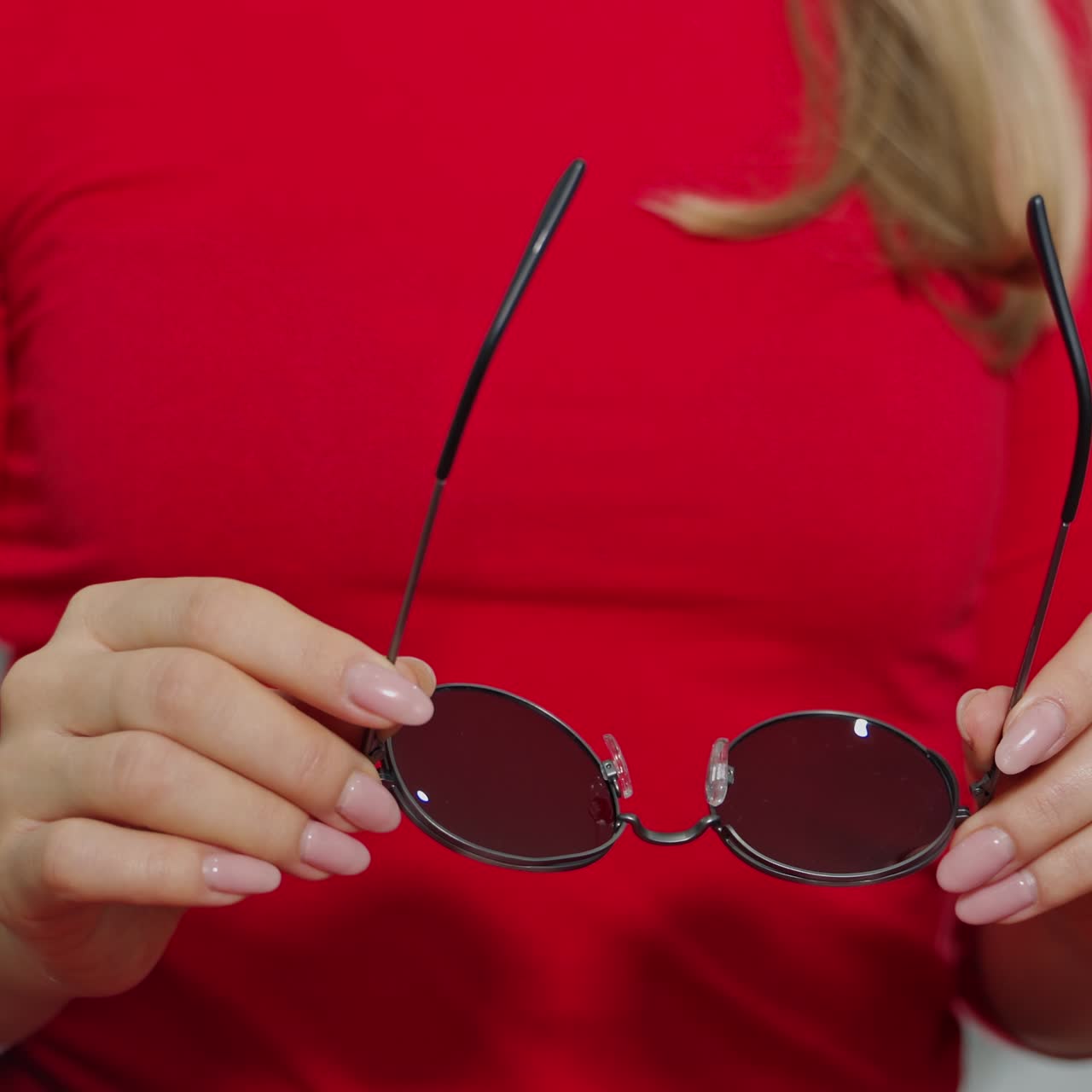 Cute girl with new glasses in shop