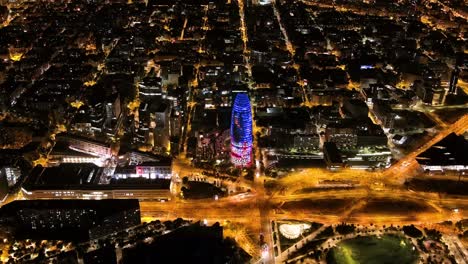 barcelona skyline with modern office buildings at night, catalonia, spain. aerial view of torre agbar (torre glòries)