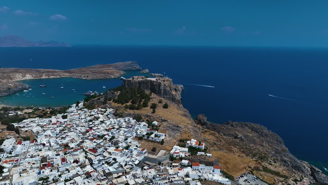 Aerial view over the town and away from the Lindos ruins, sunny day in Rhodes