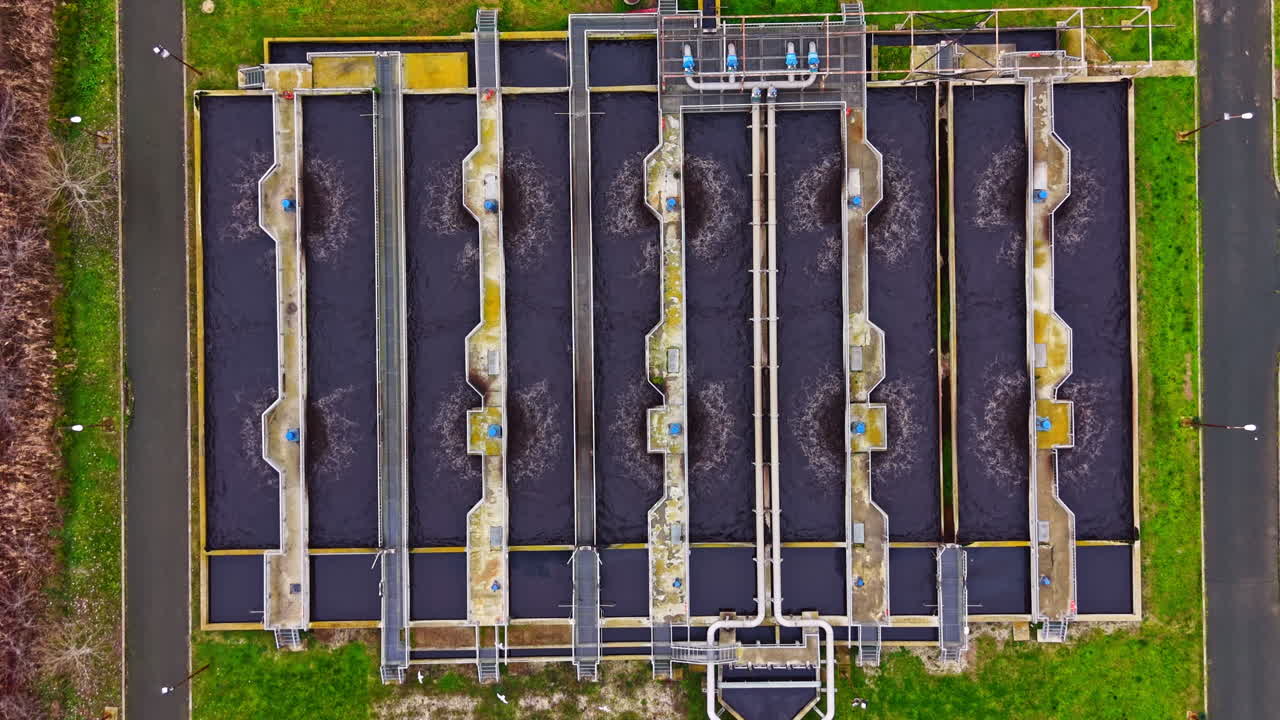 Water treatment facility processes wastewater for clean water in urban area during daytime