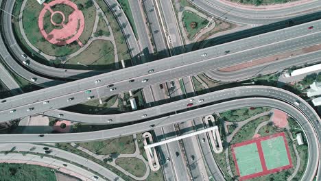 zoom in with spin effect : aerial view of beautiful highway road for distribution or transportation concept.