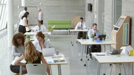 Businesspeople-Working-At-Desks-In-Modern-Office-Shot-On-R3D