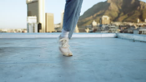 shoes, dance and music with a woman on a rooftop