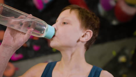 teenage boy in a climbing gym