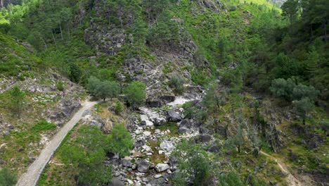 Aerial-Sightseeing-over-Fafião,-Montalegre,-and-Gerês-Rivers-and-Bridges-in-the-National-Park-of-Northern-Portugal-on-a-Sunny-Day