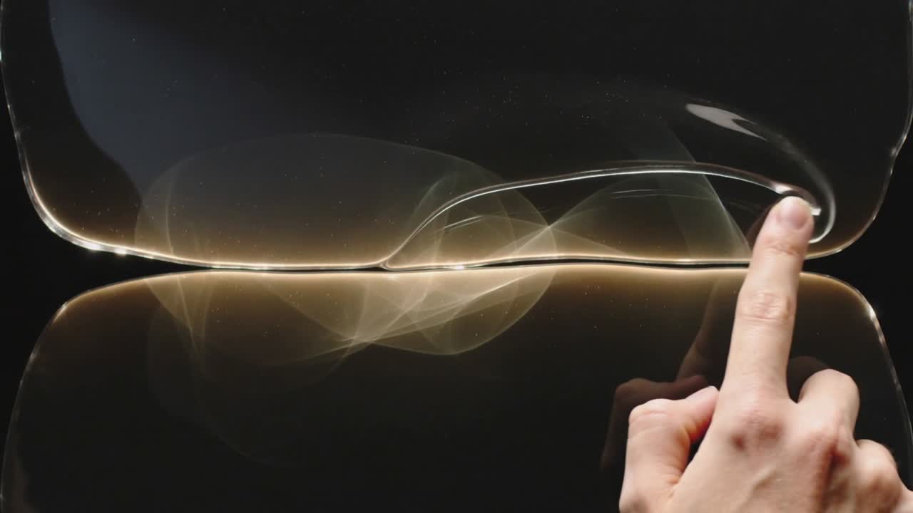 Pressing right index finger causing sliding and guiding rolling fold across membrane at studio seam