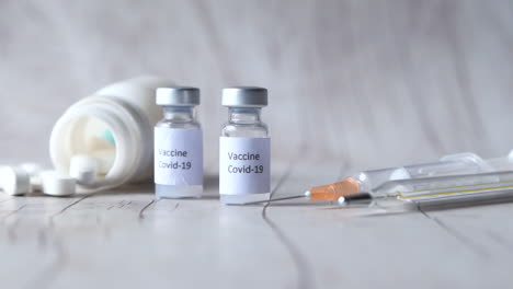 covid-19 vaccine and syringe